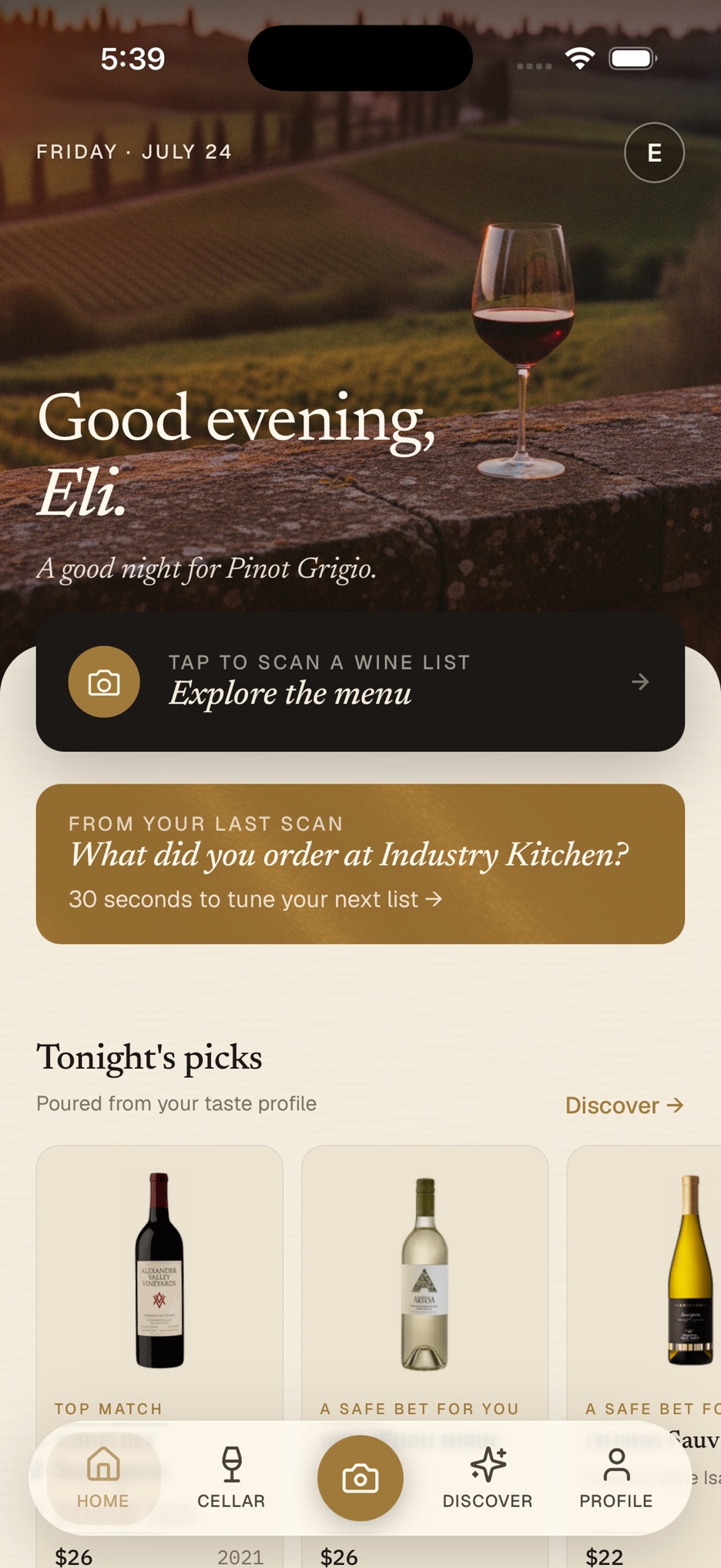 The Wine List AI home screen: a Tuscan vineyard at dusk, a greeting, a tap-to-scan button, and tonight's wine picks